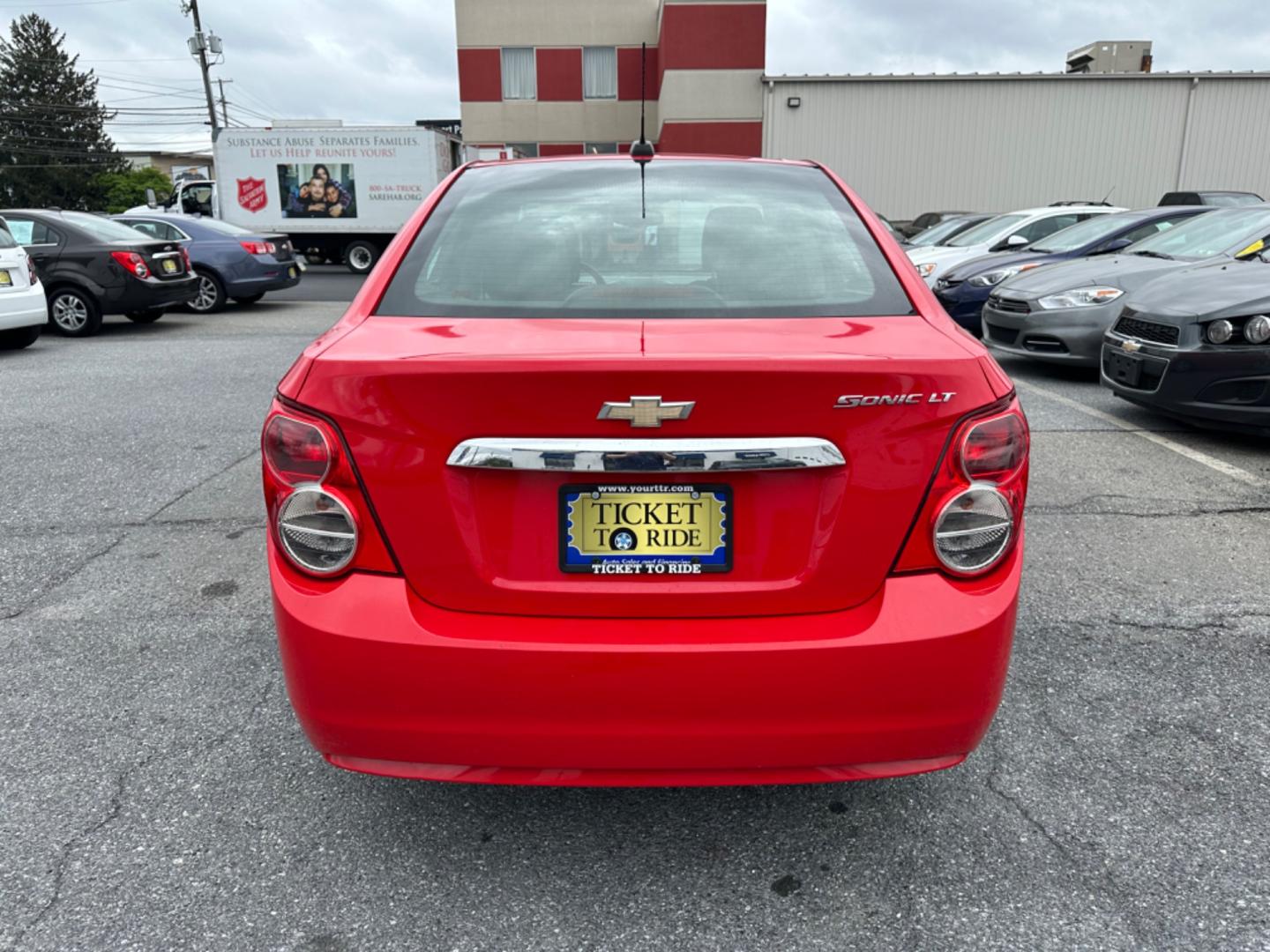 2015 RED Chevrolet Sonic LT Auto Sedan (1G1JC5SH6F4) with an 1.8L L4 DOHC 24V engine, 6-Speed Automatic transmission, located at 1254 Manheim Pike, Lancaster, PA, 17601, (717) 393-9133, 40.062870, -76.323273 - Photo#5